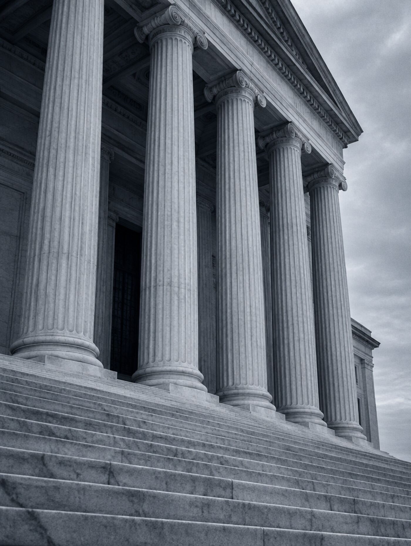 Stone columns and marble steps of a civic building